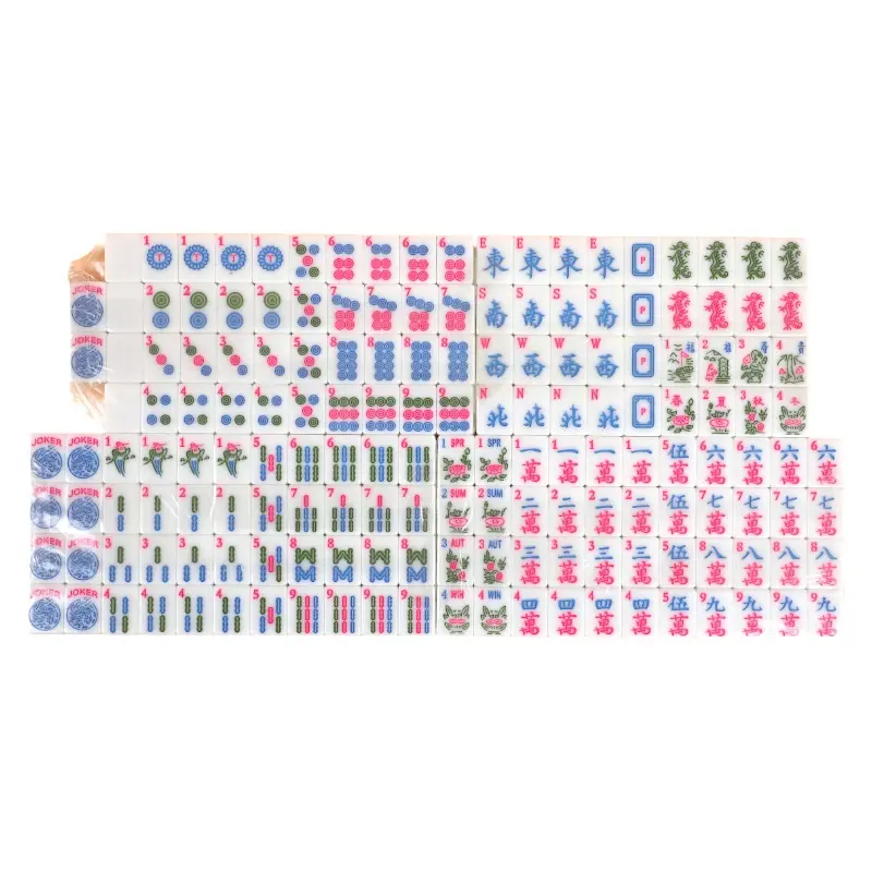 The selected ivory and mint mahjong tile set laid out on white