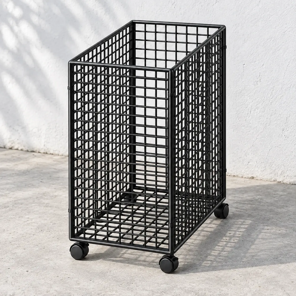 Empty black wire storage cart on a pale gray floor